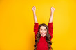 © deagreez - Portrait of amazed excited child raise fists scream wow omg celebrate wear style stylish jumper isolated over yellow color background