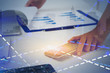© ImageFlow - Businesswoman working with stock market reports