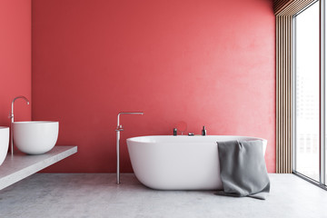 Red bathroom interior with tub and sinks