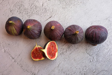 Tasty ripe figs on light grey table. Space for text. Figs are a vitamin element for dietary nutrition. The concept of healthy eating.