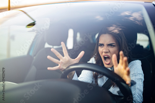 Cuadros en Lienzo Stressed woman driver sitting inside her car