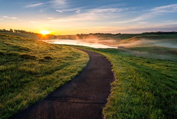 sunset on the path to the lake