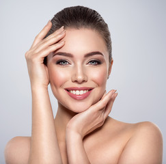 beauty face of the young beautiful smiling woman
