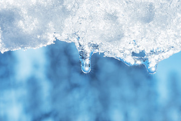 closeup of melting snow with sun reflection