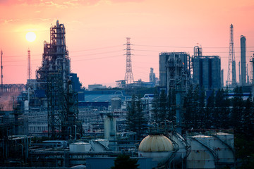 Wall Mural - chemical plant and oil refinery industry at sunrise.