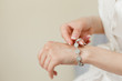 Woman's hands with perfect manicure with silver bracelet