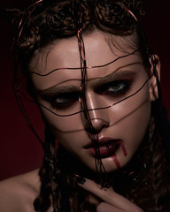 Beauty shooting in dark colors and Gothic style.