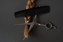 Part Blond Braids, Comb And Scissors. Black Background. Visited Tips. Close-up