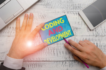 Writing note showing Coding And Development. Business concept for Programming Building simple assembly Programs