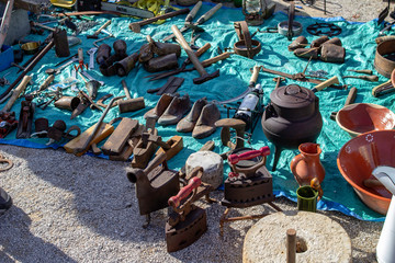 The monthly flea market in Quarteira, Portugal, where a wide selection of second hand goods are on sale.In this section second hand goods are spread on the ground.