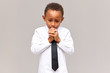 © Anatoliy Karlyuk - Portrait of nervous frustrated sad African American schoolboy in uniform looking down with worried facial expression, gnawing nails, scared of being told off for bad marks at school. Sincere emotions