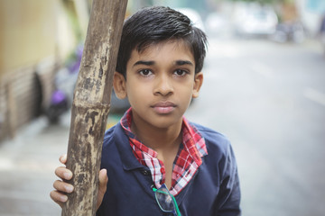 Wall Mural - Portrait of Indian boy posing to camera