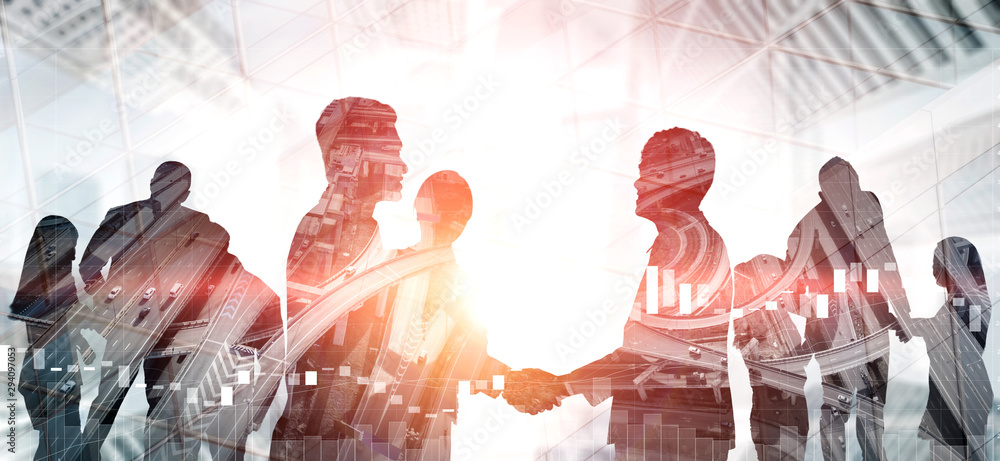 Double exposure image of many business people conference group meeting on city office building in background showing partnership success of business deal. Concept of teamwork, trust and agreement. - obrazy, fototapety, plakaty 