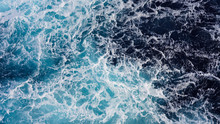 Texture Of Marine Splashes. Crashing Ocean Wave Foam Structure. Dark Blue Clear Water. Ocean Depth.