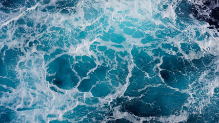  Texture of marine splashes. crashing ocean wave foam structure. Dark blue clear water. Ocean depth.