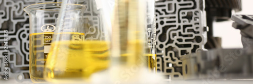 Fotografía Test tube chemistry flask against background of hydroblock acp with yellow liqui