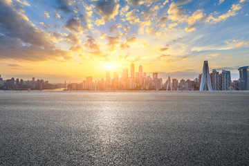 Asphalt highway and modern city financial district skyline in Chongqing at sunset,China.