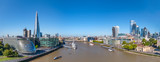 Fototapeta Londyn - Aerial cityscape panorama of the Thames river on a sunny day with the City Hall, Shard skyscraper and London City Financial district skyline.