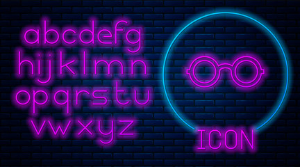 Glowing neon Glasses icon isolated on brick wall background. Eyeglass frame symbol. Neon light alphabet. Vector Illustration