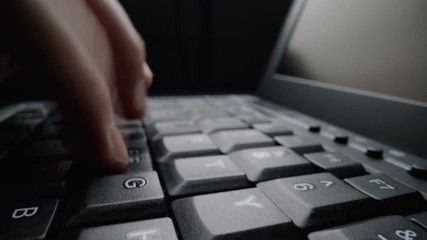 Wall Mural - time lapse close-up man typing on computer keyboard with fingers. macro soft focus dolly shot. compu
