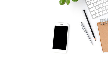 overhead shot of office desktop concept with mobile phone with empty screen and business accessories