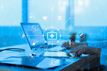 Medicine doctor or medical students with stethoscope using digital tablet laptop,Health Check with digital system support for patient with medical icon at hospital, Medical network technology concept.