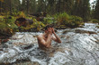 © alfa27 - young nude man washing his face while standing in the river, close up photo. lifestyle, free time. spare time