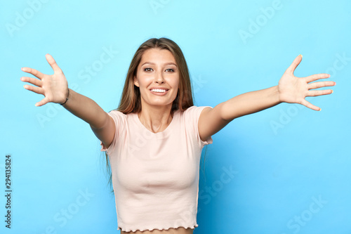Happy Young Cheerful Attractive Girl With Outstretched Hands To Embrace You Isolated On A Blue Background I Love You Positive Warm Tender Feeling And Emotion Reaction Welcome Stock Photo Adobe Stock Happy Young Cheerful Attractive Girl With Outstretched Hands To Embrace You Isolated On A Blue Background I Love You Positive Warm Tender Feeling And Emotion Reaction Welcome Stock Photo Adobe Stock