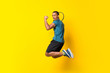 Afro American tennis player man over isolated yellow background