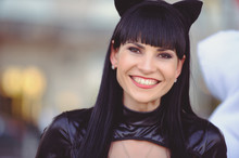 Costume Of A Beautiful Young Model Wearing A Cat Costume. Hot Sexy Brunette Cat-style Female Black Fetish Latex Leather Cat. Halloween