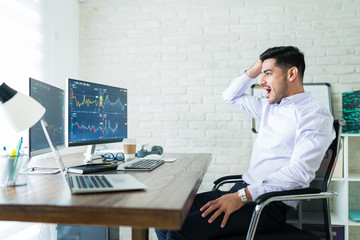 Wall Mural - attractive hispanic broker trading online from home