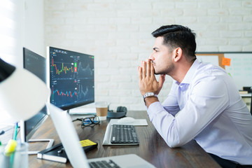 Wall Mural - attractive male finance professional concentrating on trading