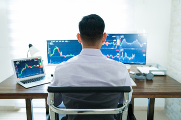 Wall Mural - freelance online trader working at desk