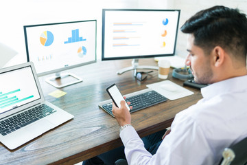 Wall Mural - young finance professional operating business from home