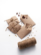 © JimmyC - Heritage, heirloom garden seeds in home made brown paper packets, collected in the fall and ready for planting in spring, on white.
