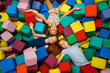 © Nomad_Soul - Happy children lying in soft cubes, playroom