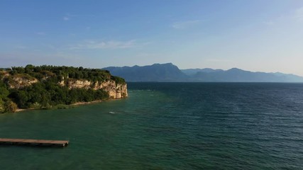 Wall Mural - Aerial view of the city of Sirmione. Lake Garda Italy. The film was shot with drone