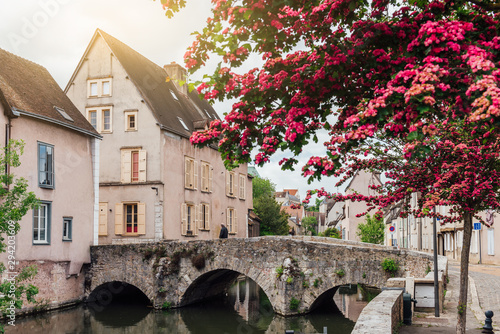 Eure River embankment with old houses in a small town Chartres, France