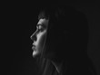 © Dima Aslanian - Portrait of young woman in profile. Low key. Black and white.