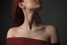 Neck And Shoulders Of Young Woman. Studio