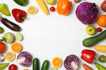 Different vegetables and fruits on wooden background, copy space