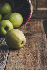 Wall Mural - Fresh ripe  green apples In wicker  basket