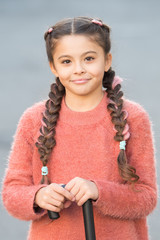 Wall Mural - Happy childhood. Happy and positive. Good mood concept. Child smile on cute face outdoors. Little happy girl braided hairstyle. Beautiful kid with fresh look and skin. International childrens day