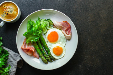 healthy breakfast (fried eggs, bacon, vegetables, asparagus beans, coffee and more) menu concept. food background. copy space. Top view