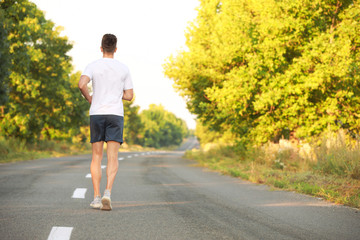 Sticker - Sporty young man running outdoors