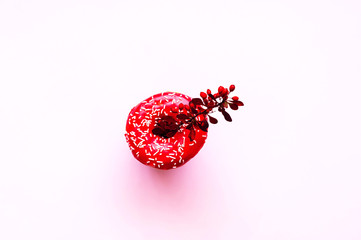 Wall Mural - Berry donut with colorful sprinkles on pink background. Concept colorful breakfast. Copy space