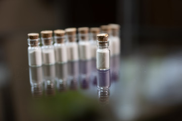 white powder in a glass jar. Poison or drug or cosmetic