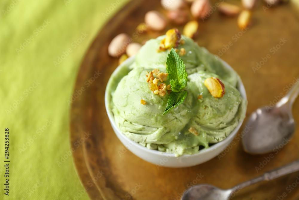 Tray with tasty pistachio ice cream on table, closeup
