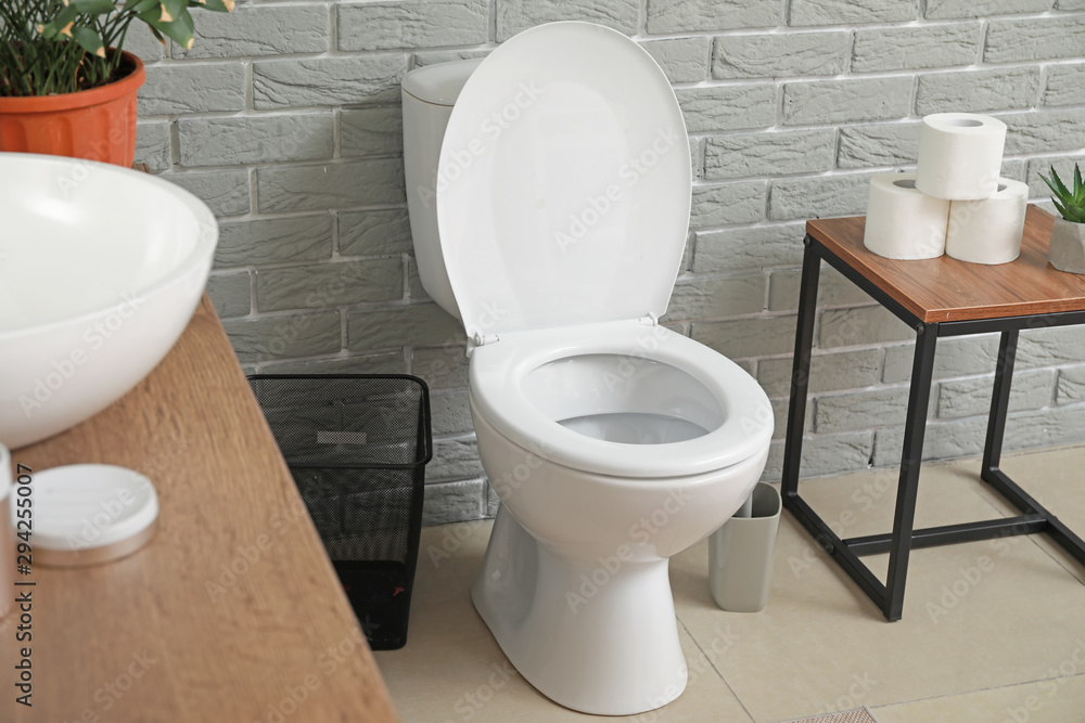 Modern toilet bowl in interior of restroom