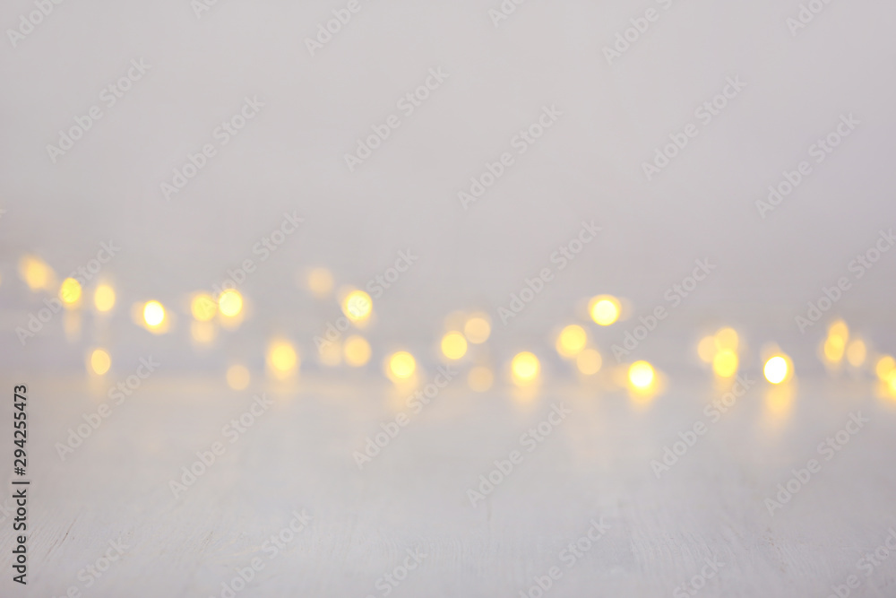 Closeup view of white table with blurred lights